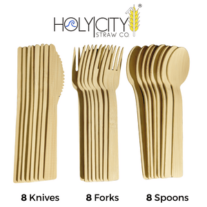 An array of biodegradable bamboo cutlery by Holy City Straw Co., neatly presented in three groups. On the left are eight knives with serrated edges, in the middle are eight forks with sturdy tines, and on the right are eight spoons with deep, rounded bowls. The company's logo is prominently displayed above the cutlery, emphasizing the eco-conscious brand.