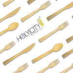 An array of natural bamboo forks, knives, and spoons arranged diagonally on a white background, centered around the HolyCity Straw Co. logo with a stylized wave and golden wheat graphic.