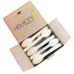 Holy City Straw Co. unwrapped bamboo dessert spoon next to lemon sweet plate
