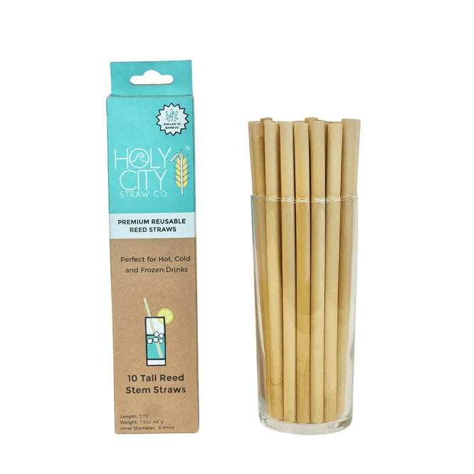 Holy City Straw Co Premium Reusable Reed Straws, 10-count pack, displayed in a glass container. The product is ideal for hot, cold, and frozen drinks, featuring eco-friendly, natural reed material.