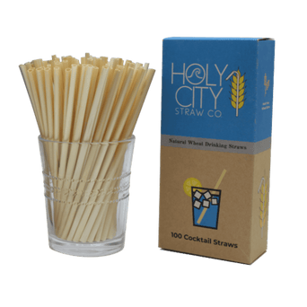100 count box of Holy City Straw Company cocktail wheat straws next to a cup of straws
