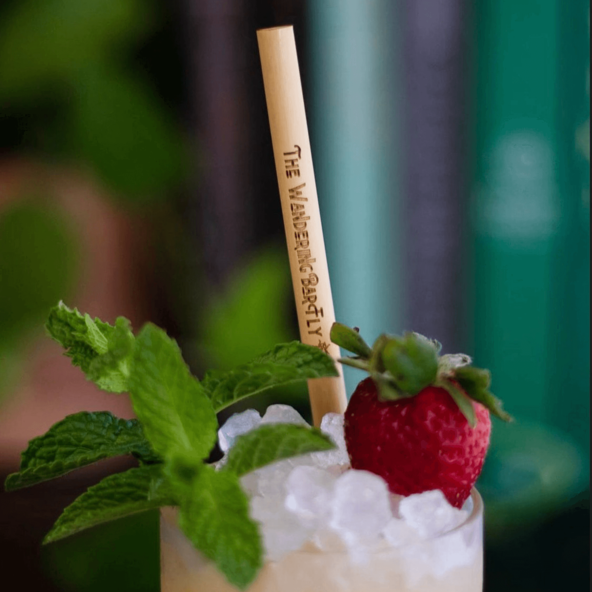 Strawberry cocktail with wandering fly engraved straw