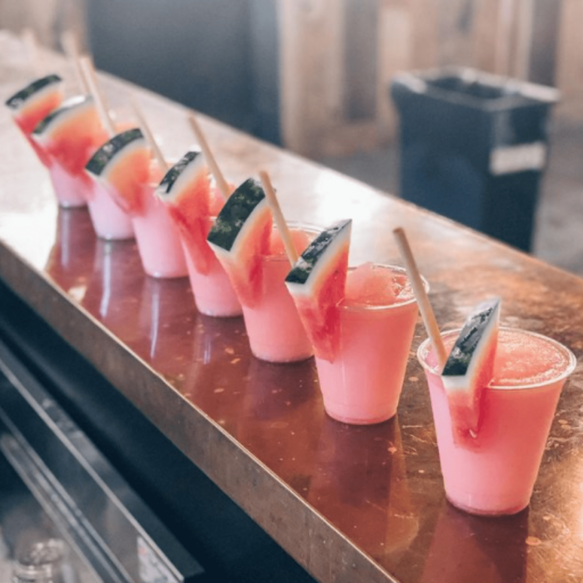 frozen watermelon line of cocktails at bar