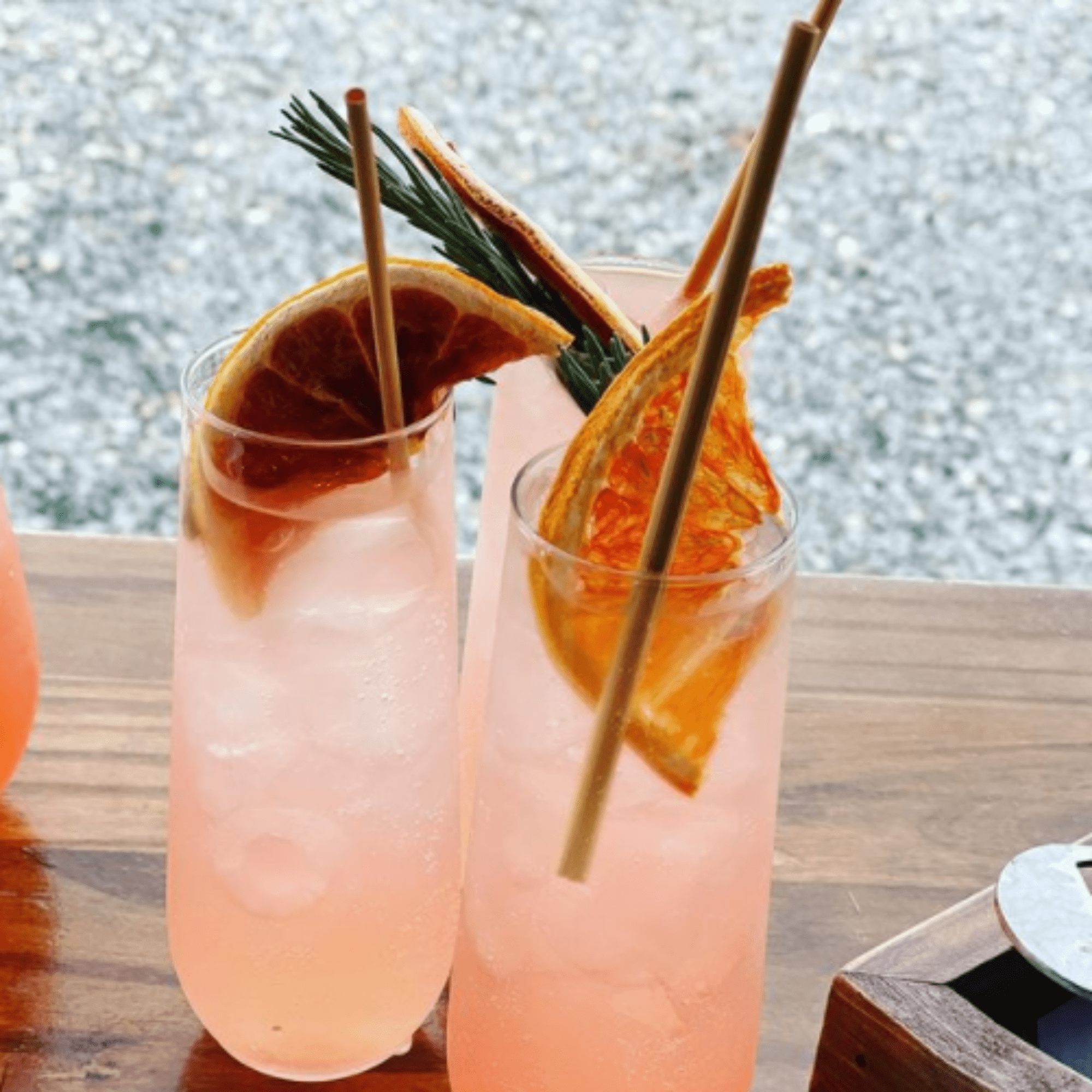 grapefruit infused drinking with orange garnish