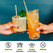 two hands cheersing tropical and citrus cocktail with wheat straw